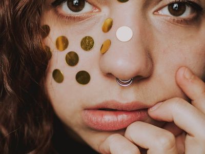 Close-up of a woman's hands in a meditative pose.