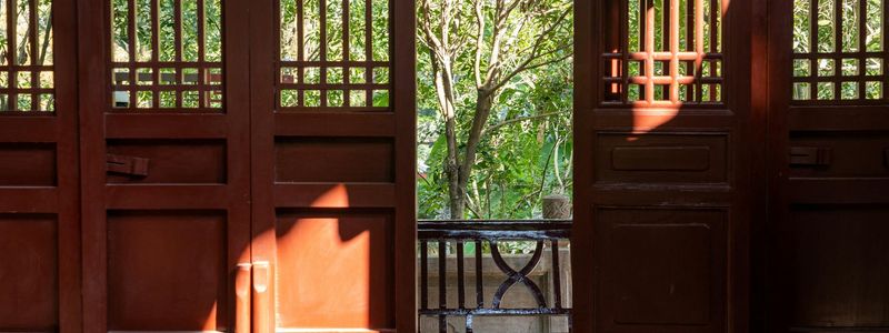 Sunlight streaming through a large window onto a wooden floor.